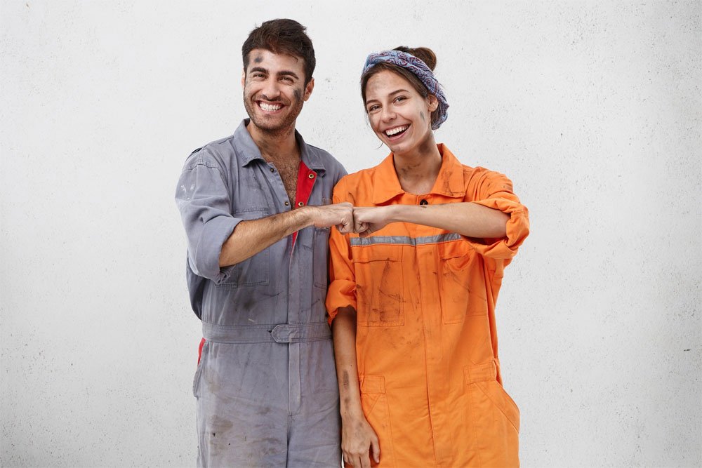 Two mechanics collaborating in a workshop